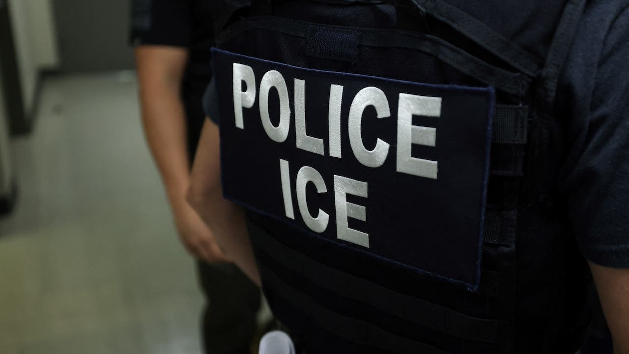 An agent of Immigration and Customs Enforcement (ICE) waits in a hallway outside of a courtroom at New York Federal Plaza Immigration Court inside the Jacob K. Javitz Federal Building in New York on July 17, 2025.
