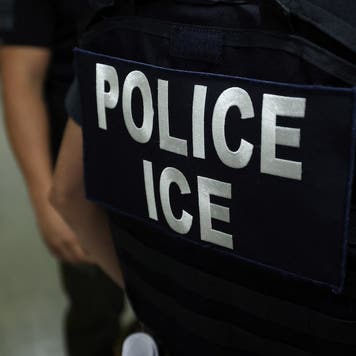 An agent of Immigration and Customs Enforcement (ICE) waits in a hallway outside of a courtroom at New York Federal Plaza Immigration Court inside the Jacob K. Javitz Federal Building in New York on July 17, 2025.