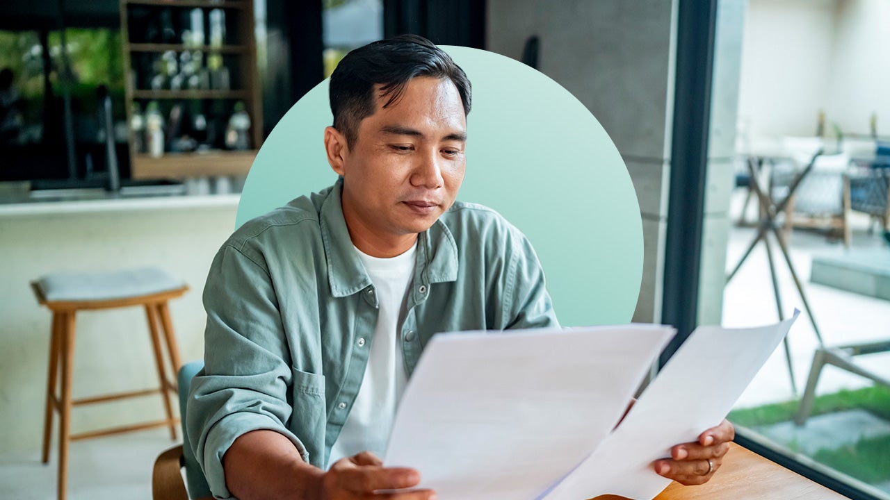 man reading paperwork side by side