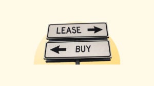 Sign with the word lease pointing right and the word buy pointing left.