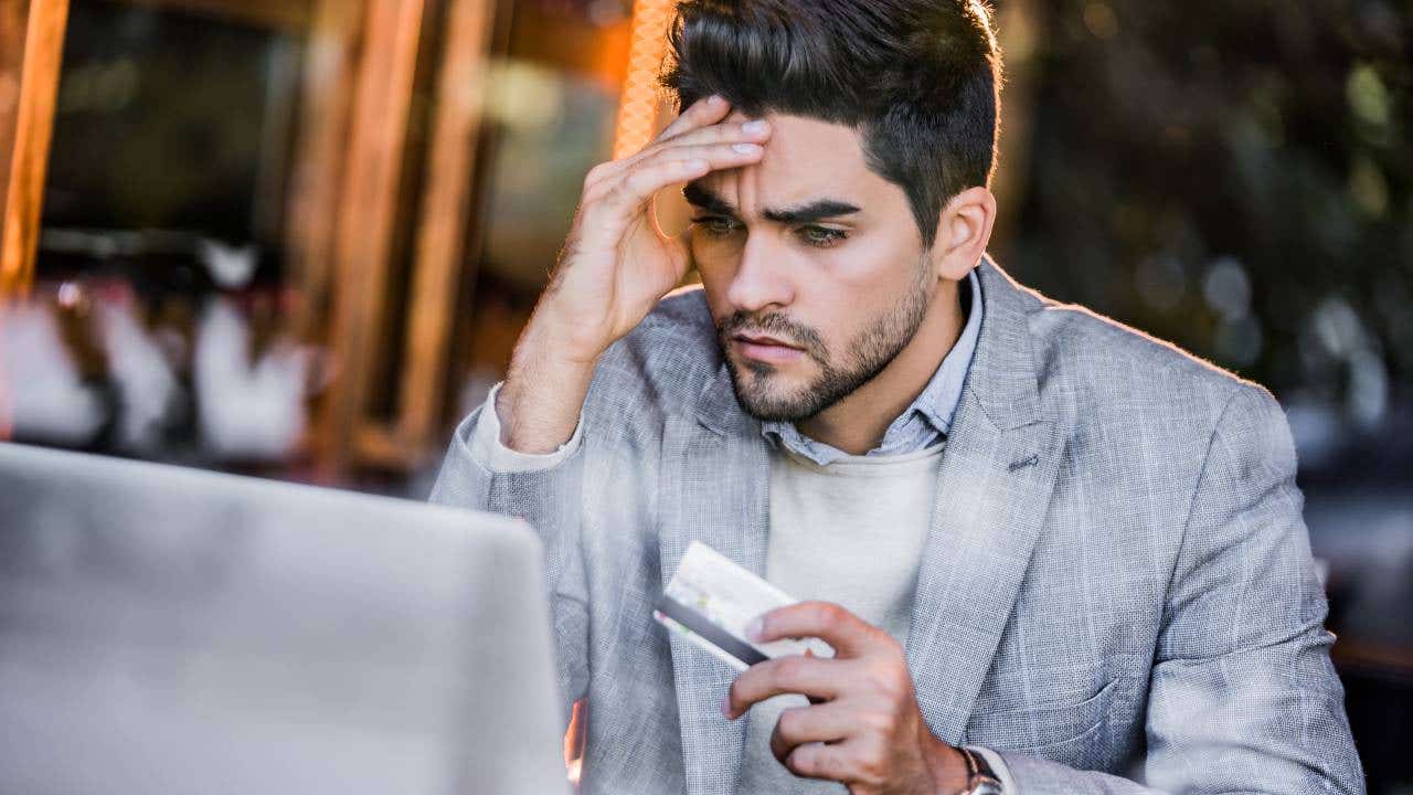 Young man having more expenses than expected.