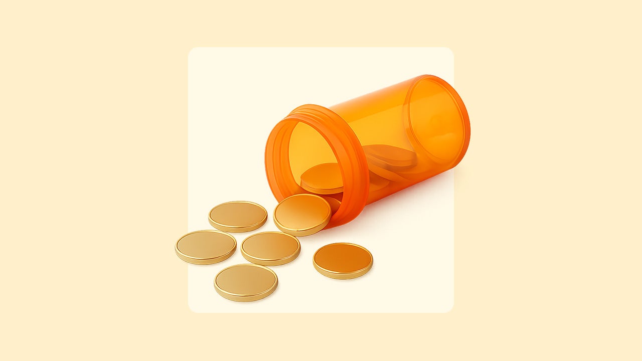 Coins spill out of a prescription pill container