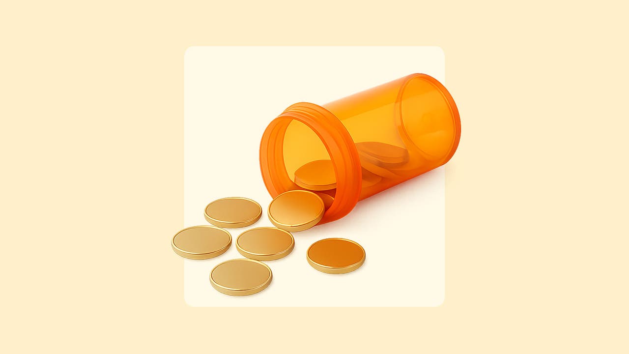 Coins spill out of a prescription pill container