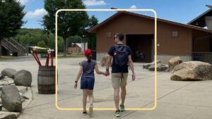 The author, John Puterbaugh, walks with his daughter, Abby