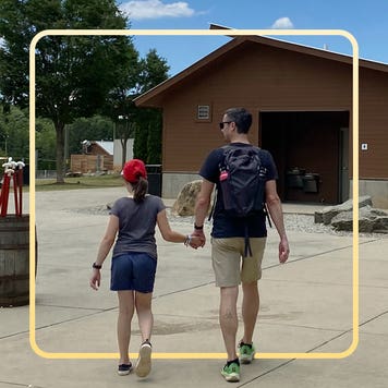 The author, John Puterbaugh, walks with his daughter, Abby