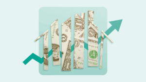 Torn-up dollar bills that create the shape of a house with an upward arrow in the background