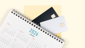 Credit cards lay with a 2026 calendar on a yellow background