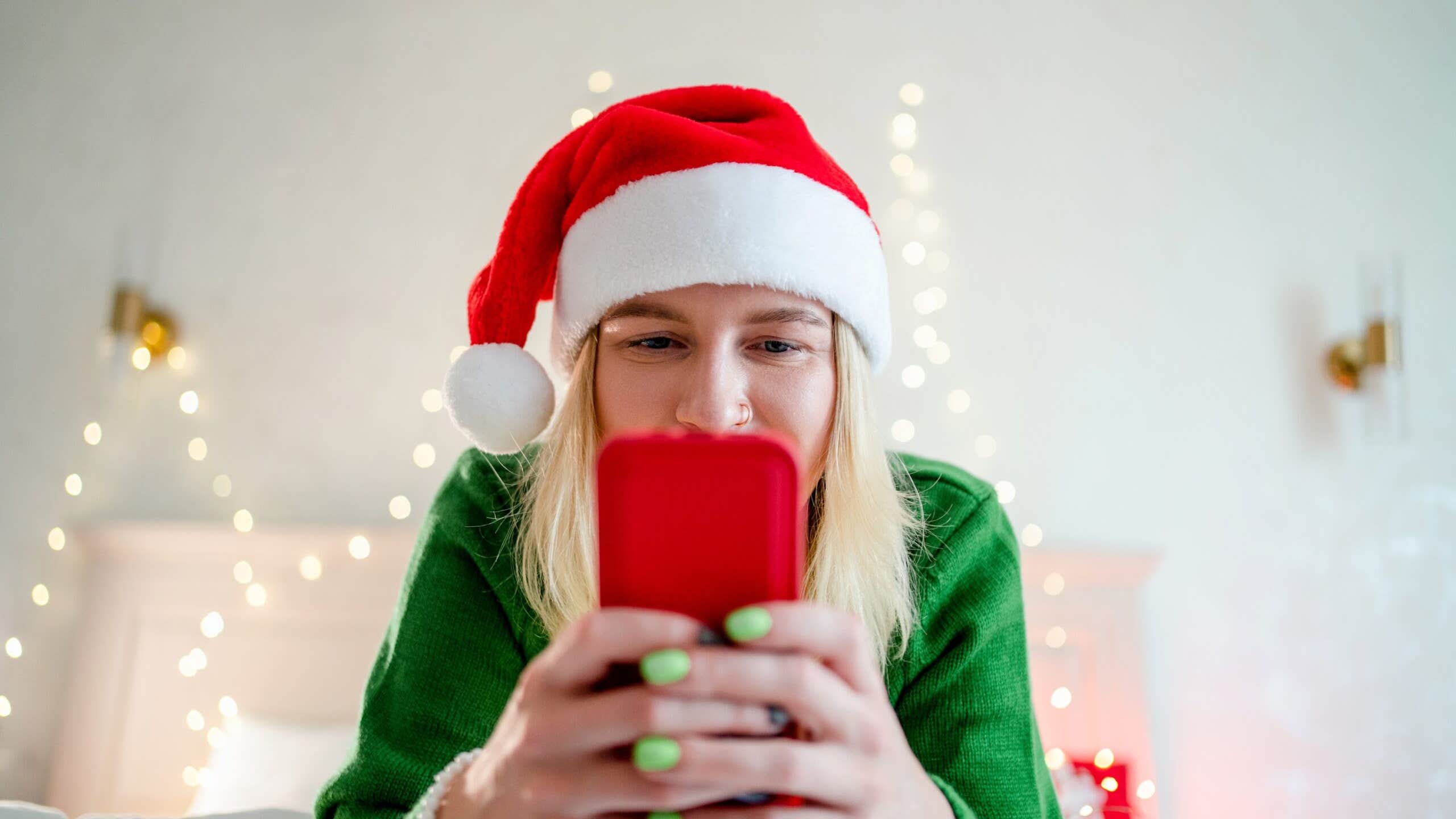 A woman shops on her phone.