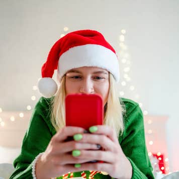 A woman shops on her phone.