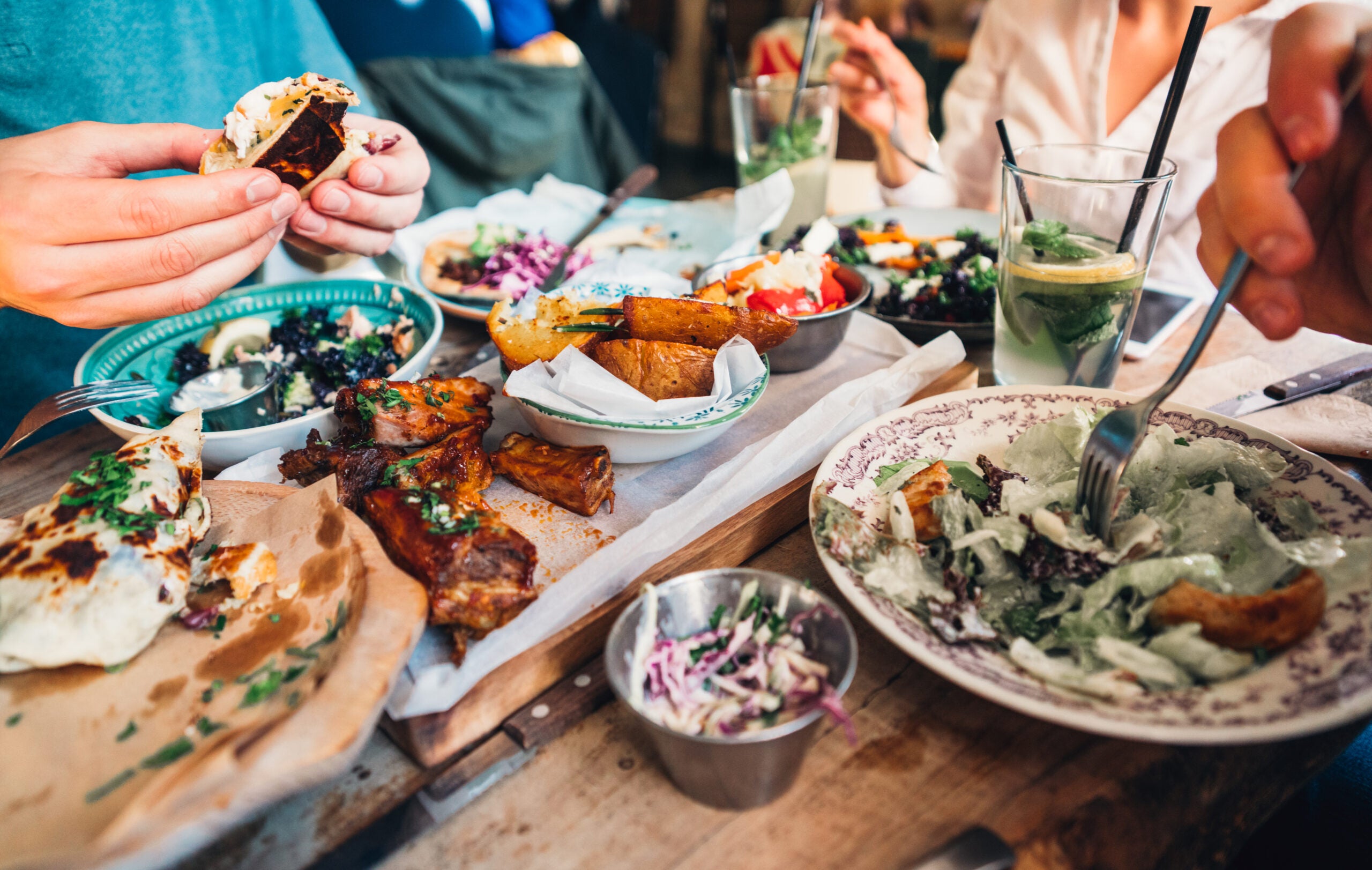A closeup of food spread on a restaurant table
