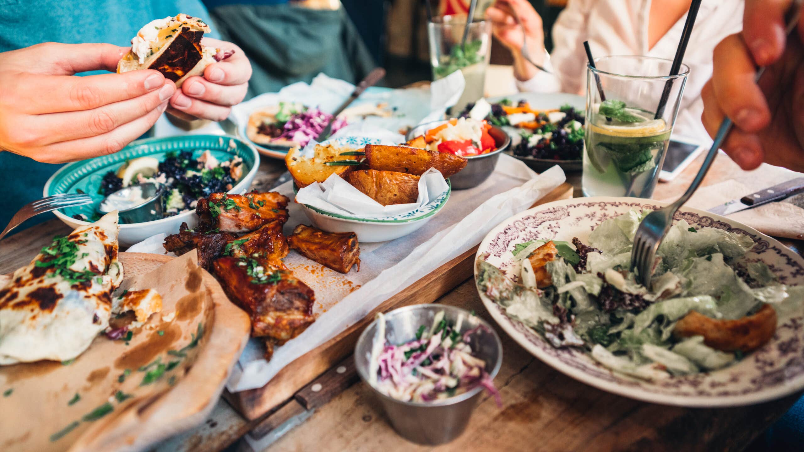 A closeup of food spread on a restaurant table