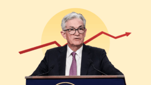 Jerome Powell in front of interest rate graphic
