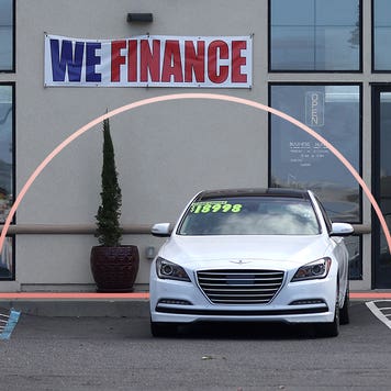 A dealership with a "We Finance" banner