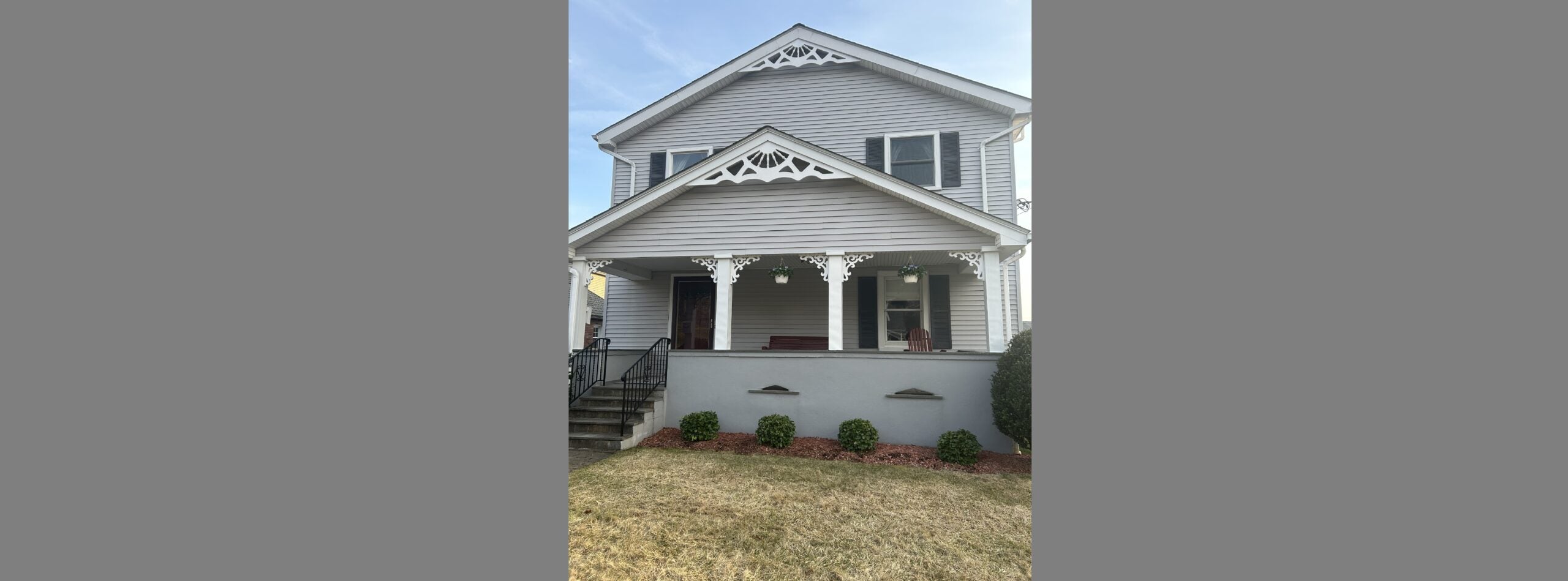Image of a gray two-story home